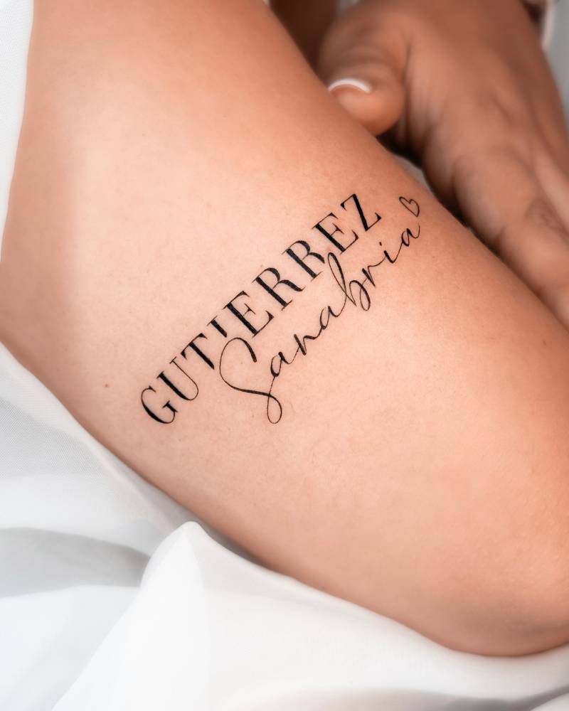 Name "Gutierrez Sanabria" tattoo located on the tricep.