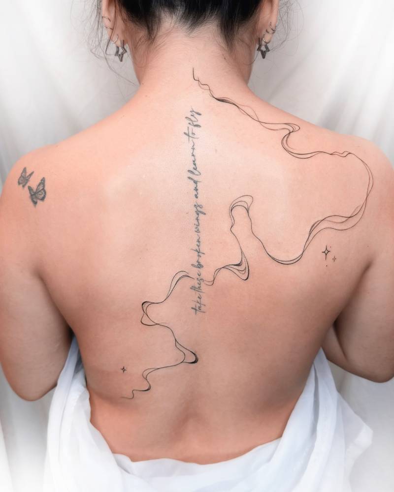 Abstract tattoo located on the back.