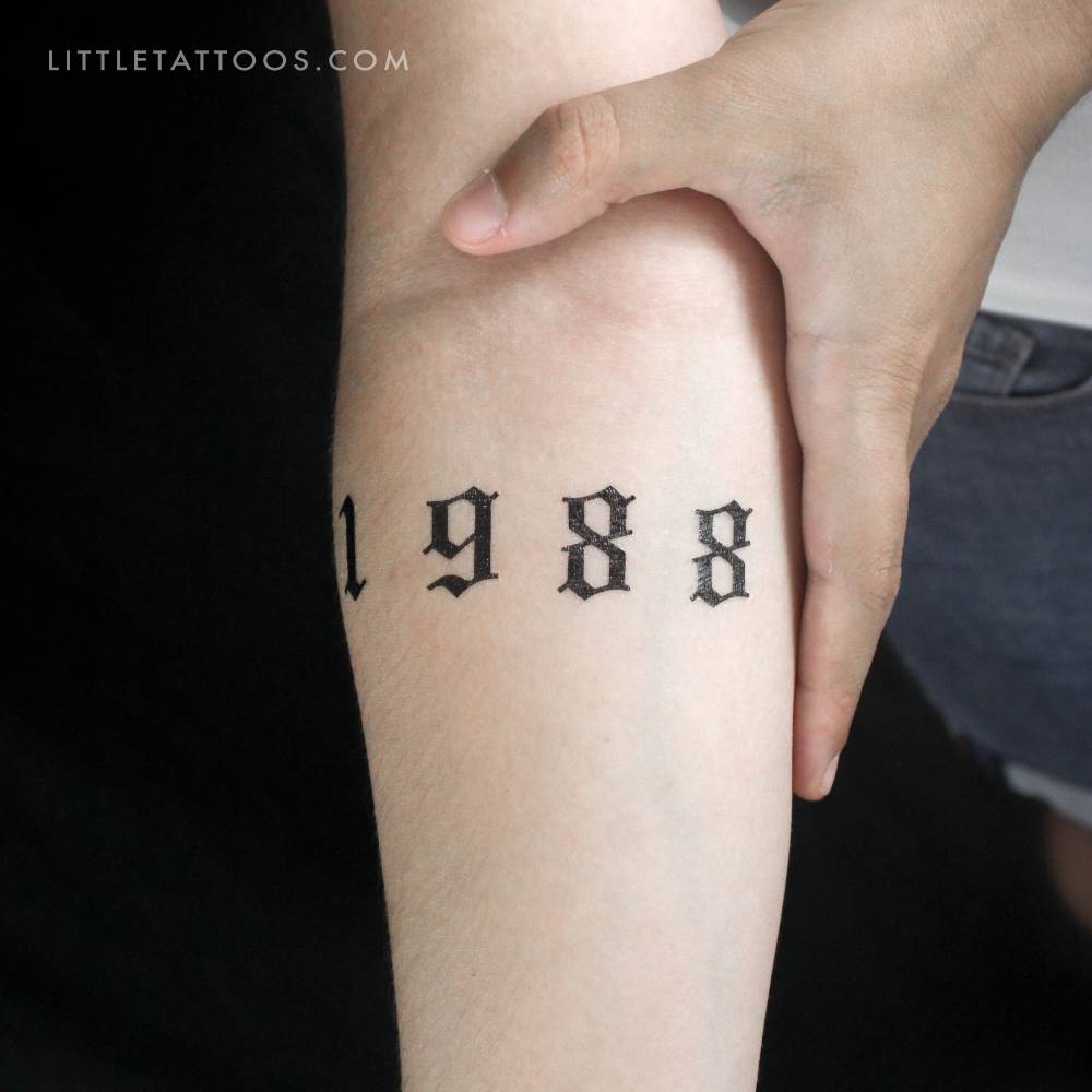 Rihanna's 1988 birth year temporary tattoo located on the inner forearm.