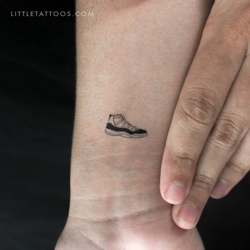 Illustrative style Air Jordan XI temporary tattoo located on the wrist.