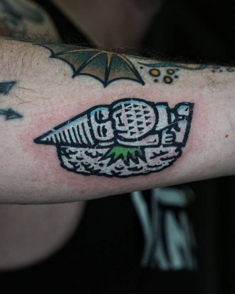 Gnome Nigiri tattoo in pop art style placed on the forearm.