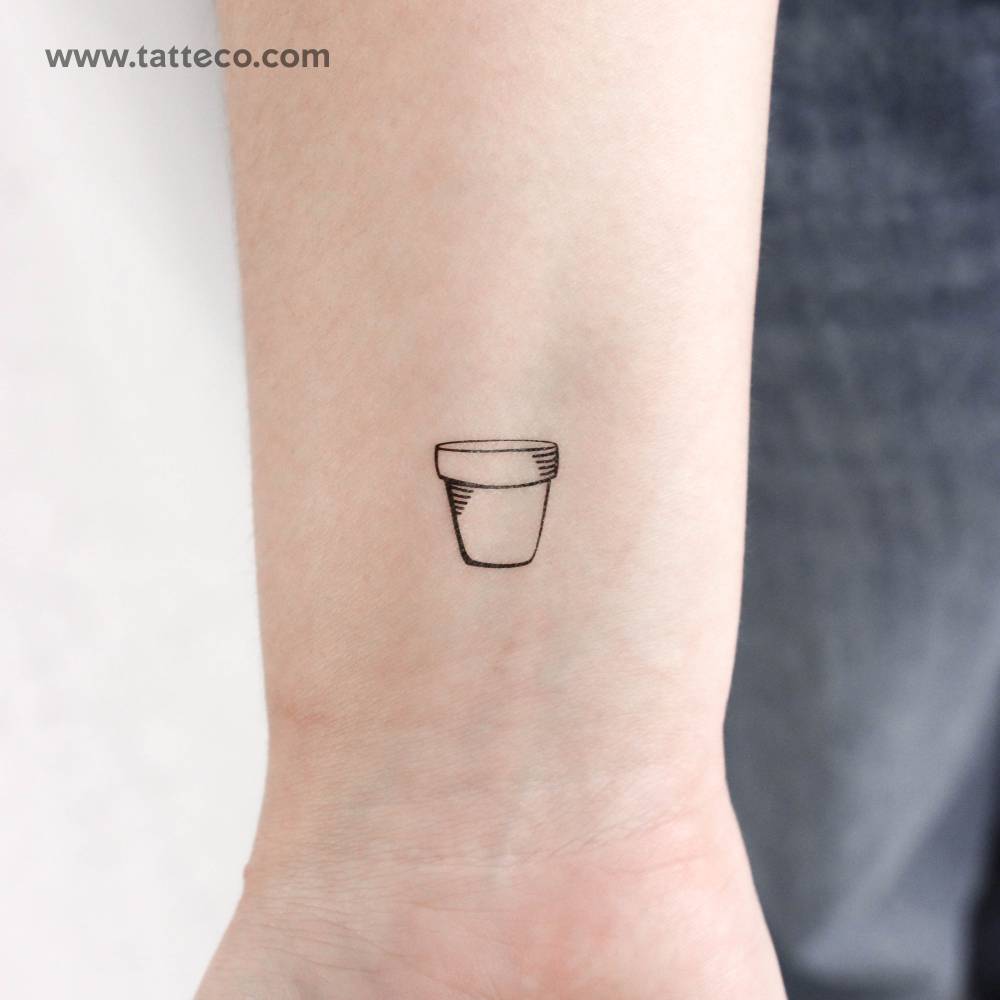 Fine line style flower pot temporary tattoo located on the wrist.