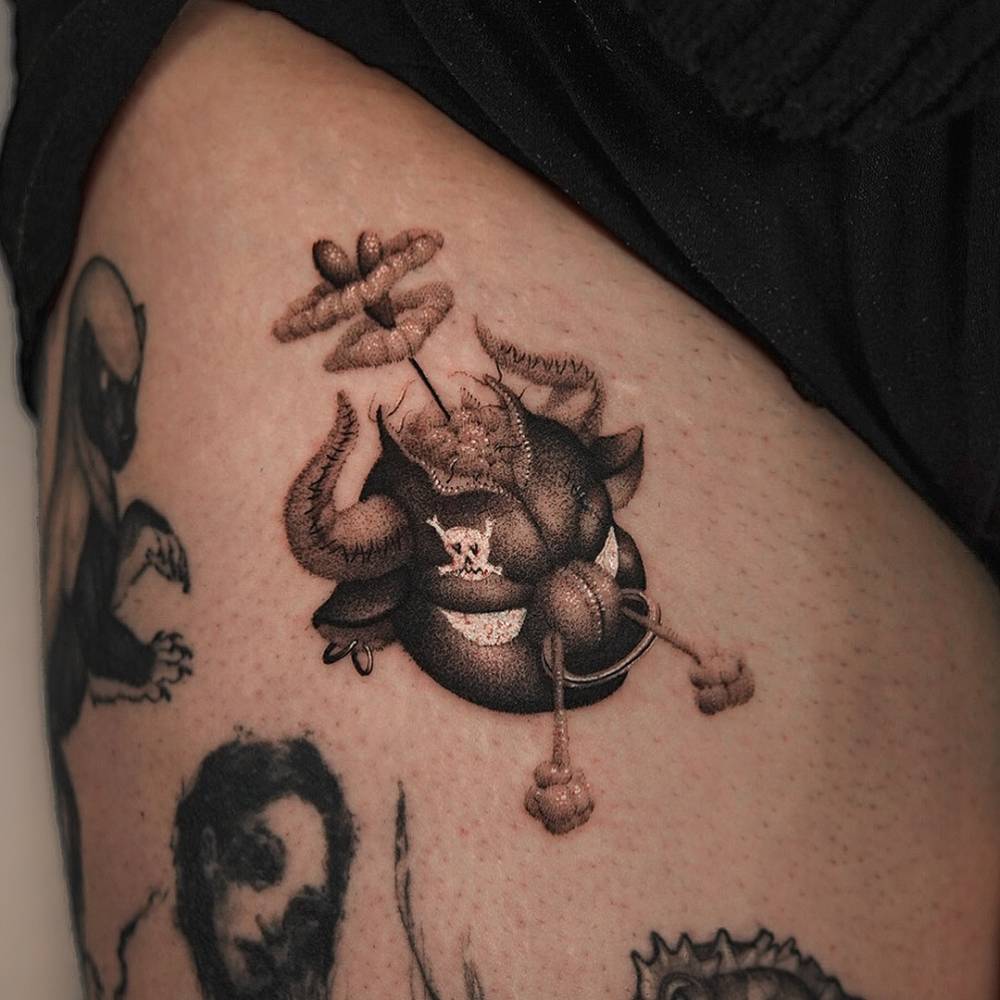 Teddy bull portrait tattoo in dotwork style located on the thigh.