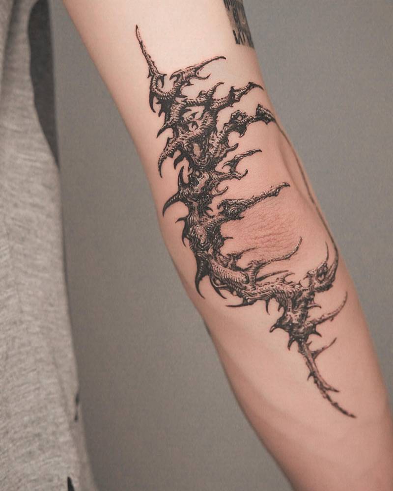 Thorns tattoo in illustrative style done on the elbow.