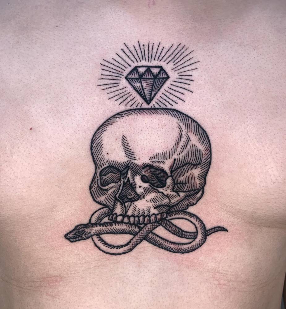 Skull, snake and diamond tattoo located on the chest, blackwork style.