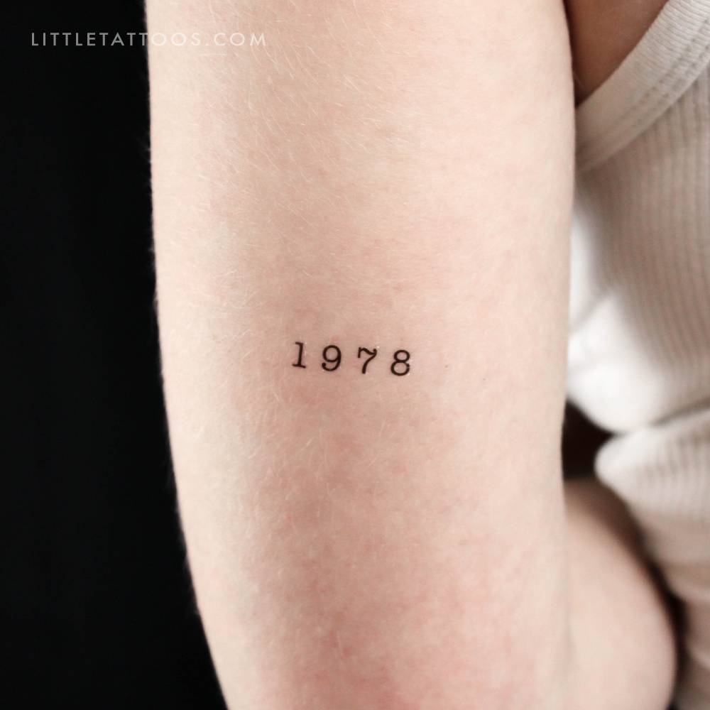 "1978" birth year temporary tattoo located on the tricep.
