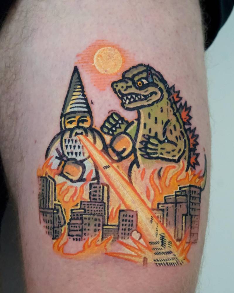 Godzilla and gnome tattoo.