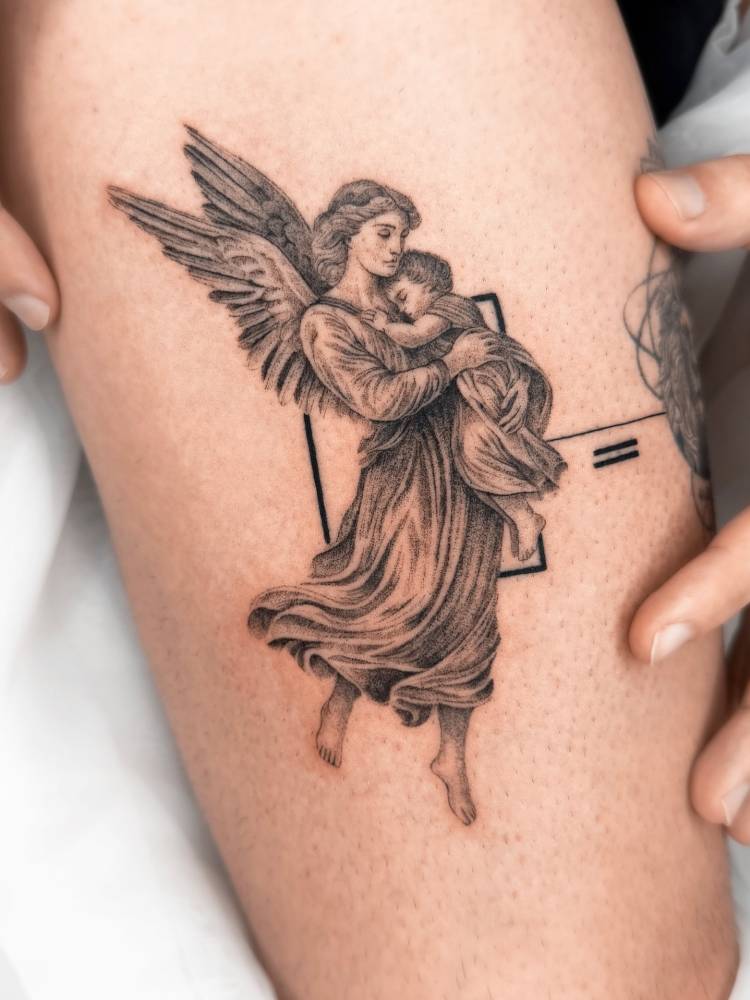 Guardian angel tattoo located on the inner arm.