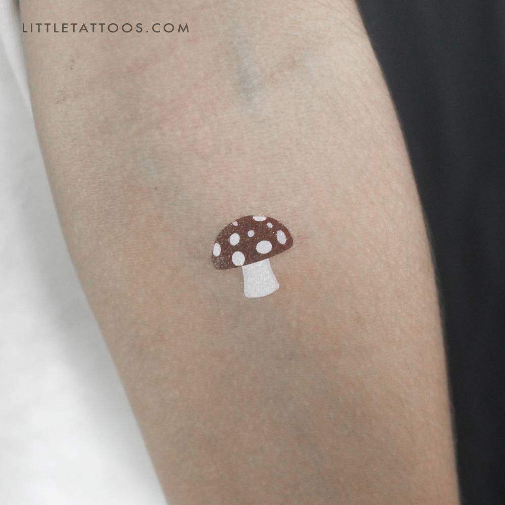 Watercolor style red mushroom temporary tattoo.