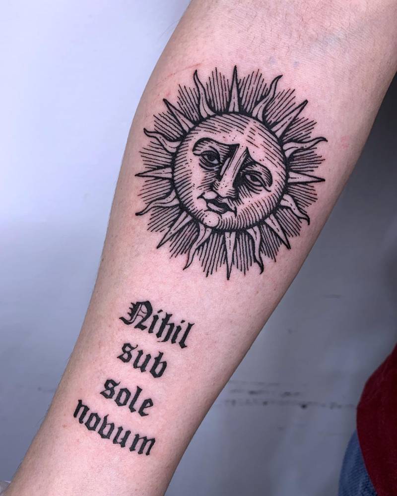Inti sun and "nihil sub sole novum" tattoo located on the inner forearm, blackwork style.