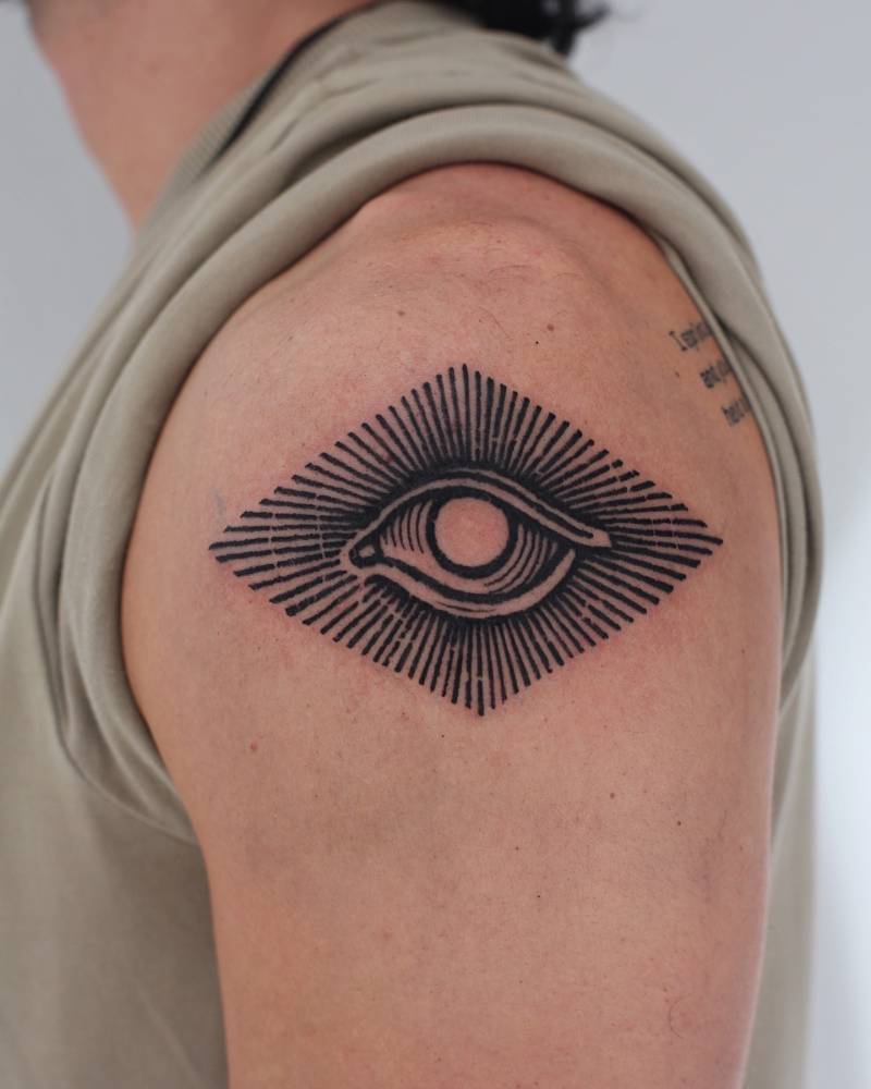 Eye tattoo in engraving style done on the shoulder.