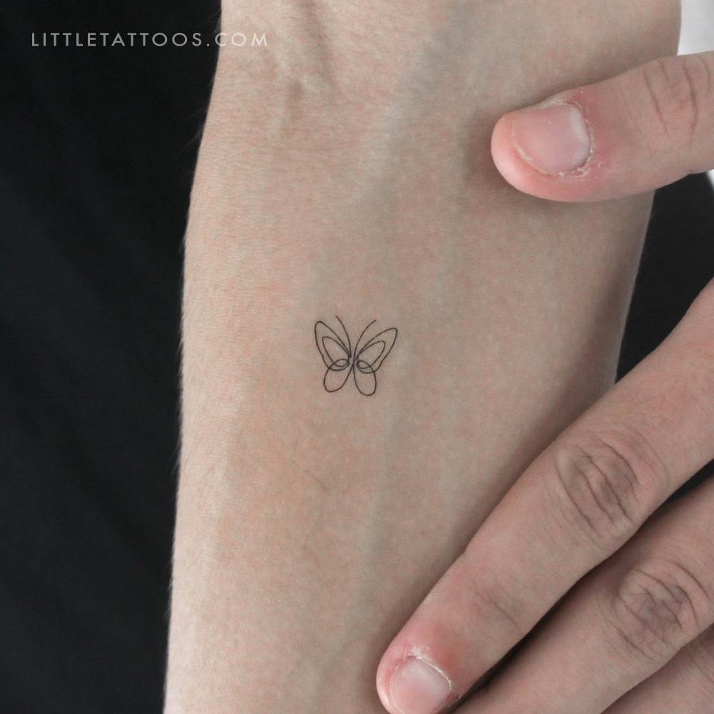 Single line butterfly temporary tattoo done on the inner forearm.