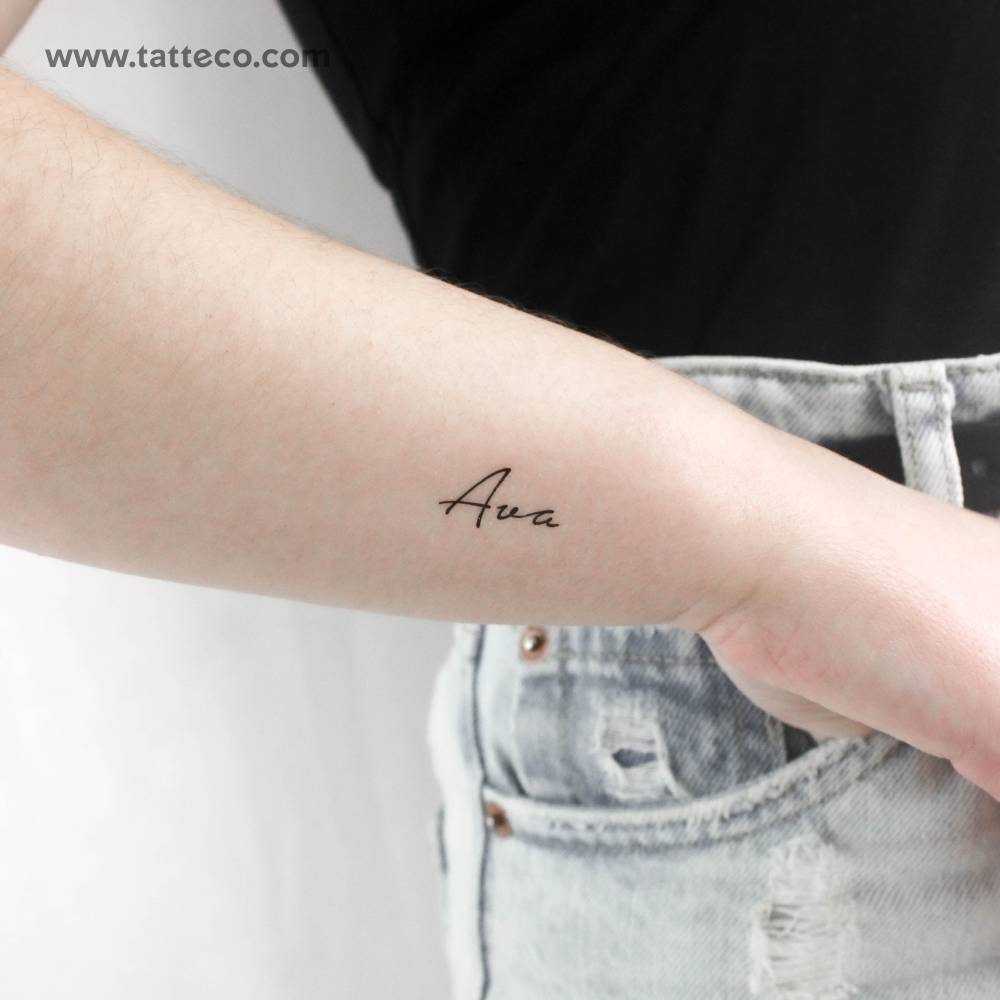 Name "Ava" temporary lettering tattoo located on the wrist.