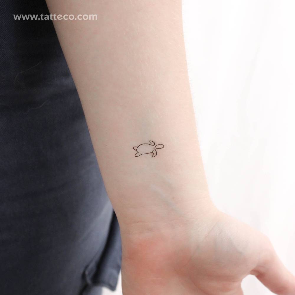 Single line turtle temporary tattoo placed on the wrist.