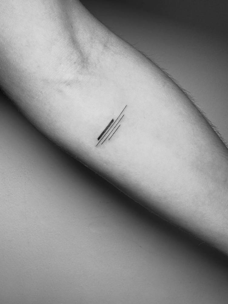 Lines tattoo in geometric style located on the inner forearm.