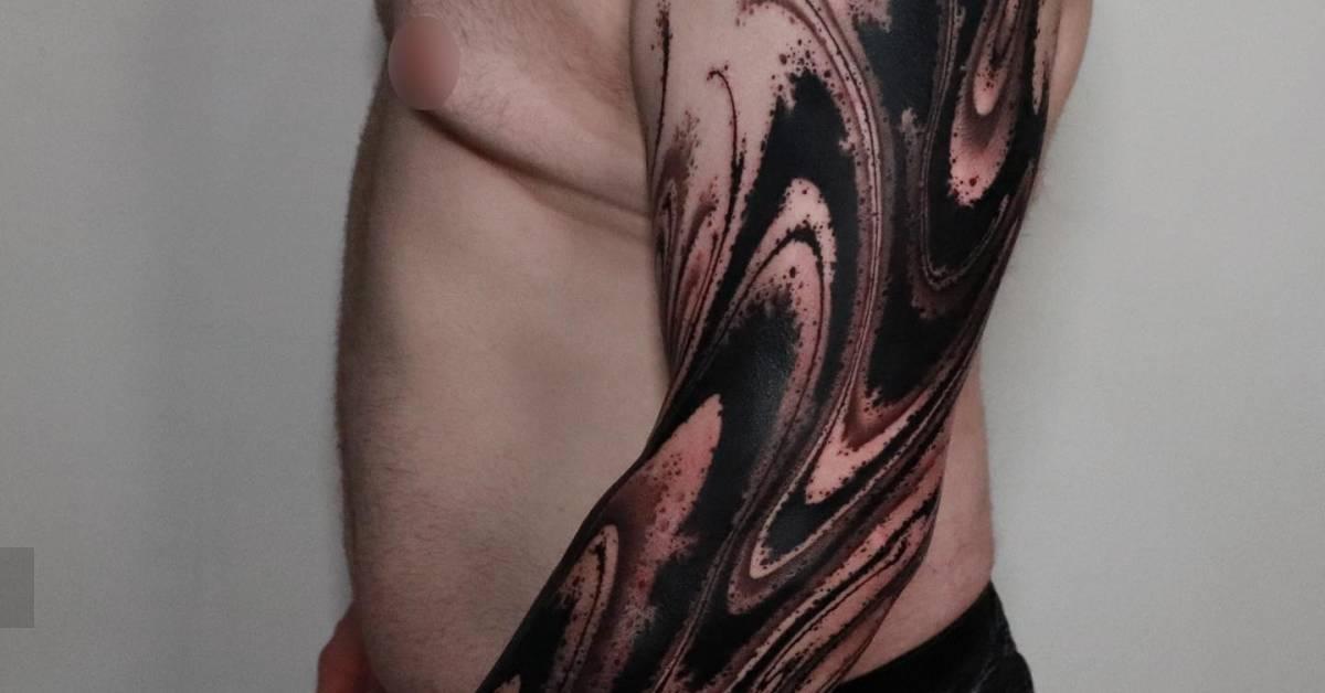 Abstract tattoo sleeve in blackwork style.