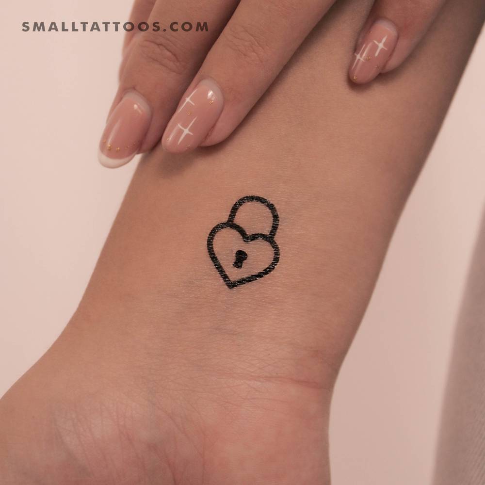 Minimalistic style heart padlock temporary tattoo located on the wrist.