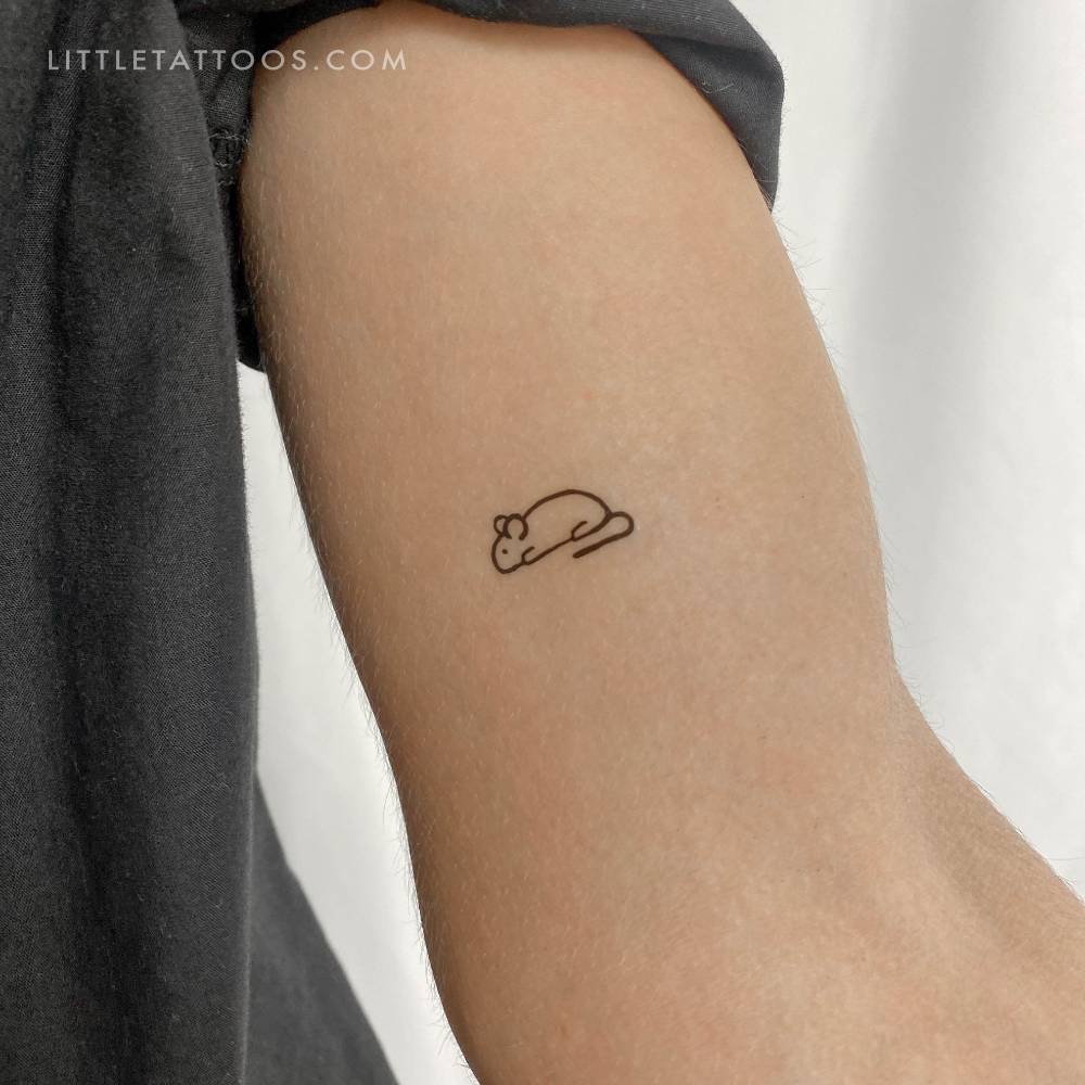 Mouse temporary tattoo in minimalistic style located on the inner arm.