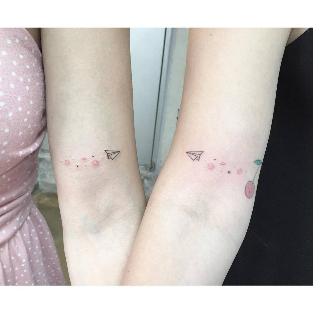 Matching paper plane and galaxy tattoo for best friends.
