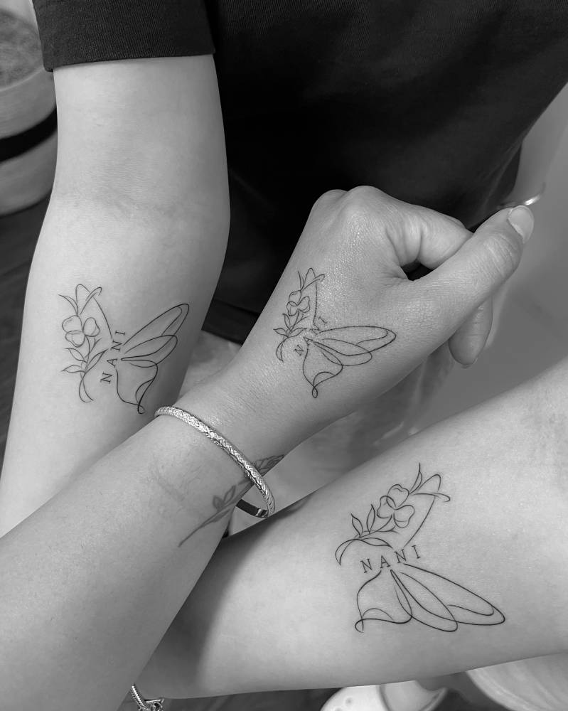 Matching half butterfly half flower tattoo for best friends.