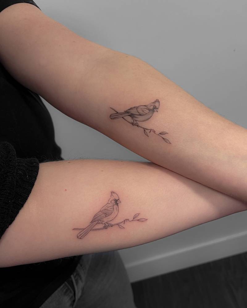 Matching cardinal on a branch tattoo for best friends.
