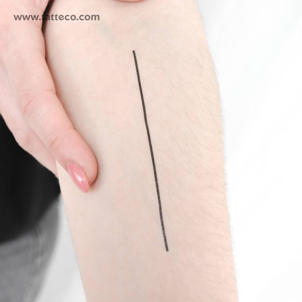 Straight line temporary tattoo located on the inner forearm.