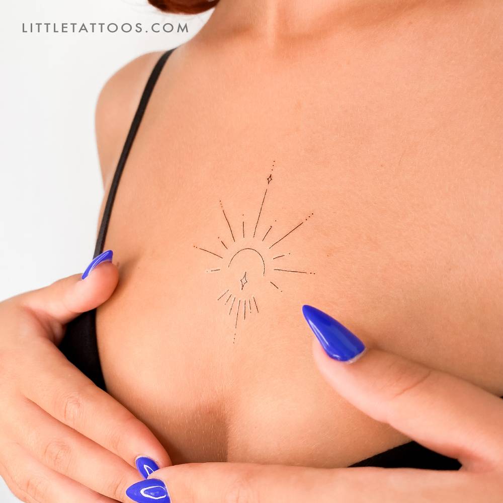 Ornamental temporary tattoo by 1991.ink located on the sternum.