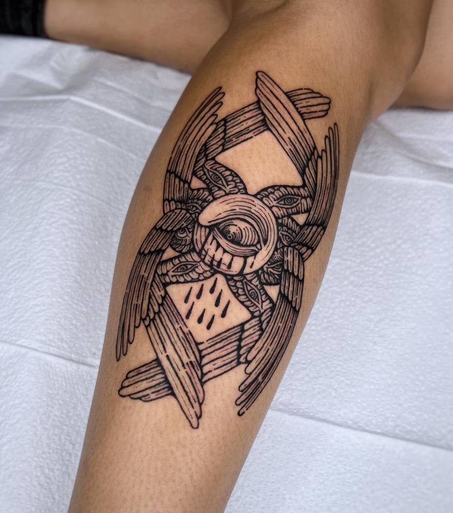 Seraphim tattoo in engraving style located on the calf.