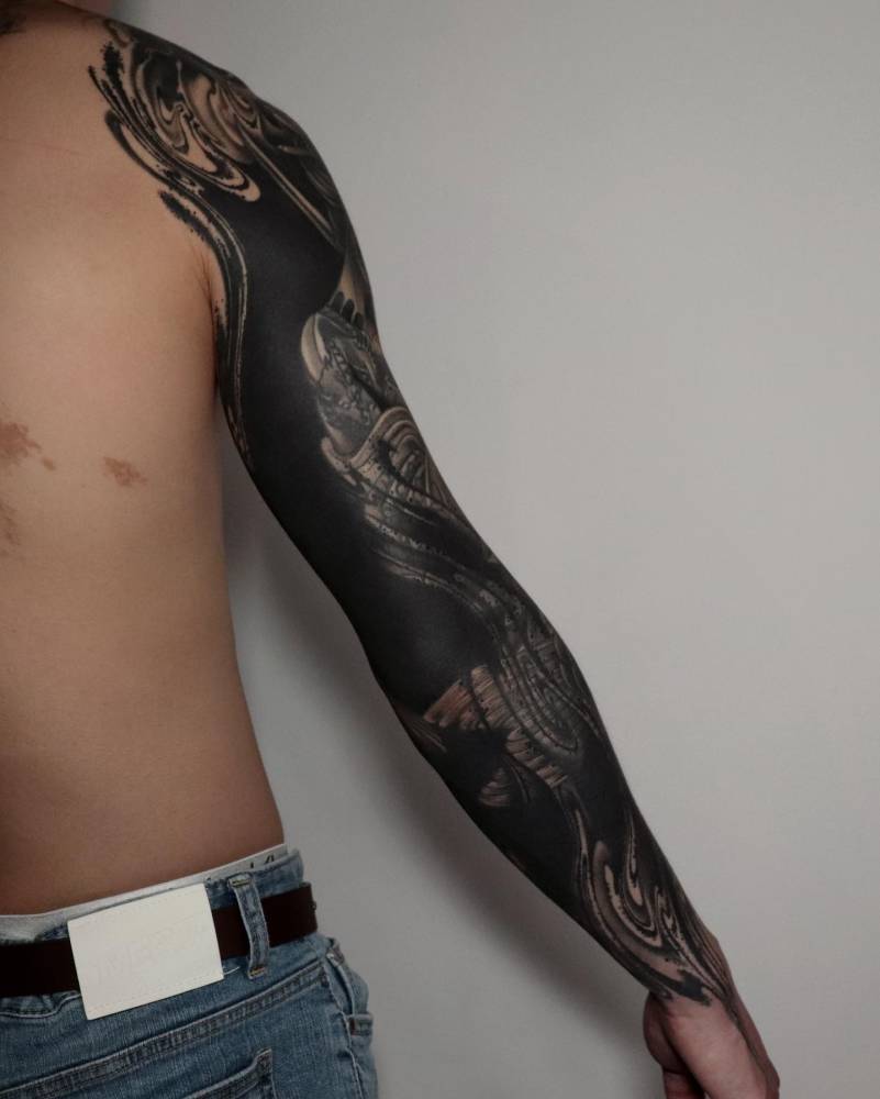 Abstract style blackwork cover up tattoo sleeve.