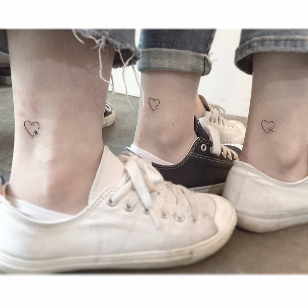 Matching minimalistic heart tattoos for best friends.