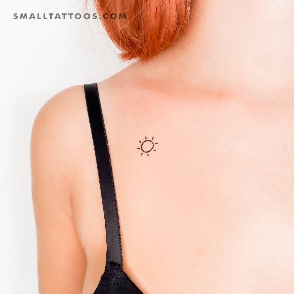 Sun temporary tattoo in minimalistic style located on the chest.