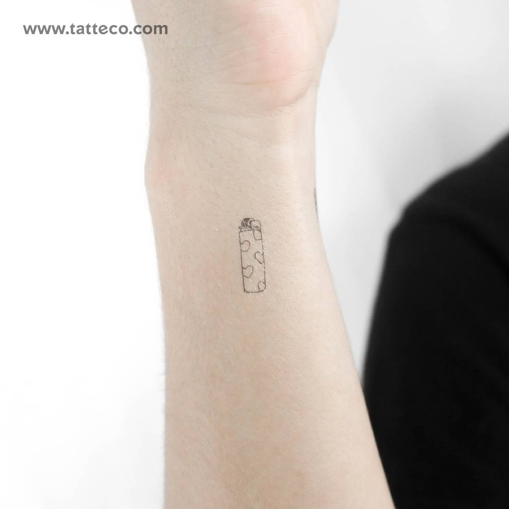 Fine line style lighter temporary tattoo located on the wrist.