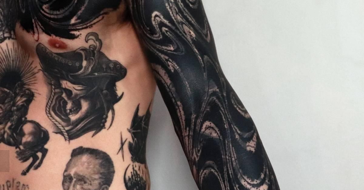 Abstract cover up tattoo sleeve done in blackwork