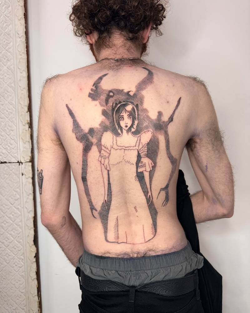 Woman and devil tattoo in cartoon style located on the back.