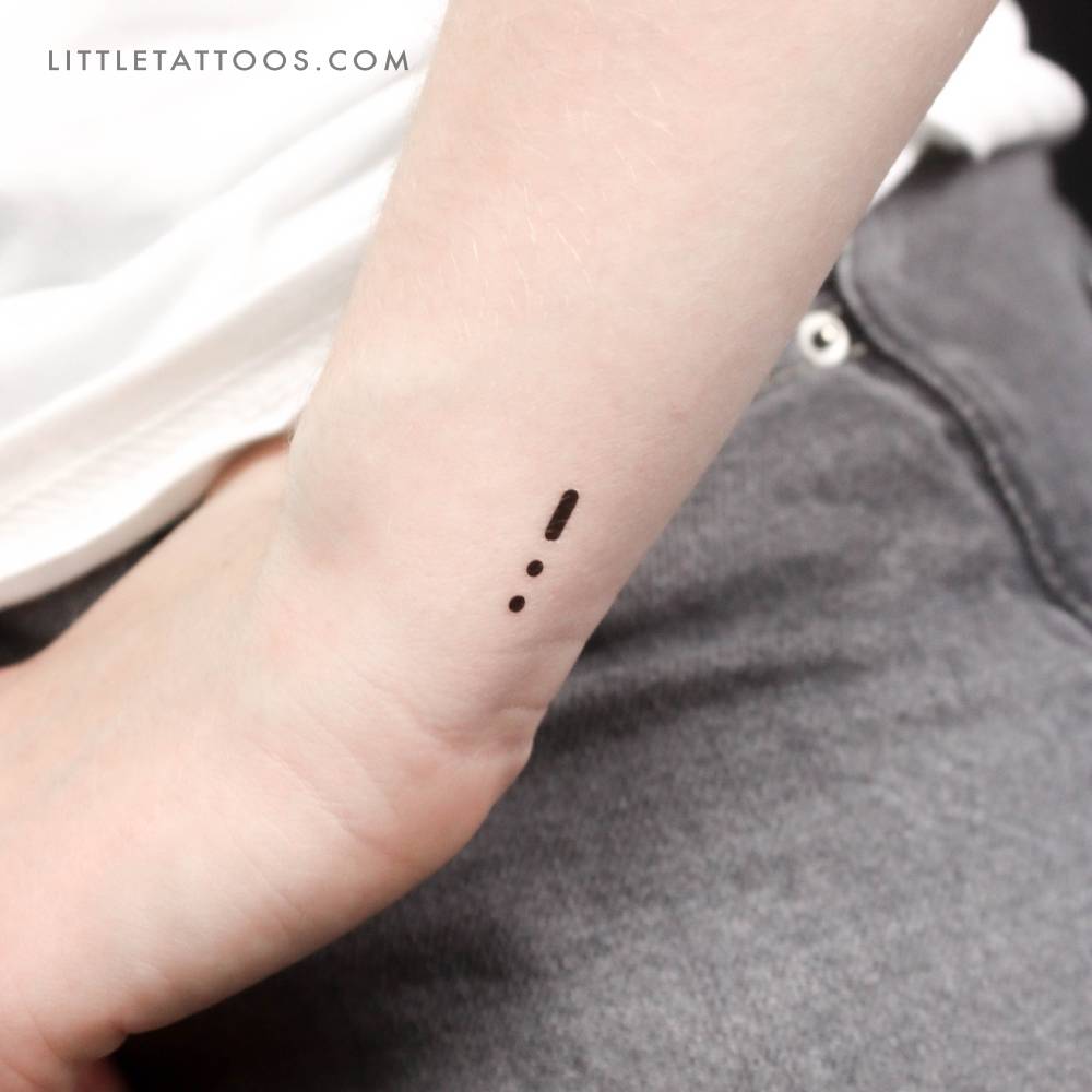 Morse Code "U" temporary tattoo located on the wrist.