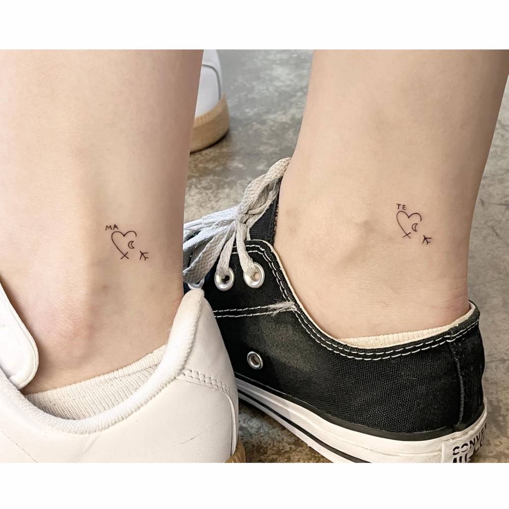 Matching airplane and heart tattoo for best friends.