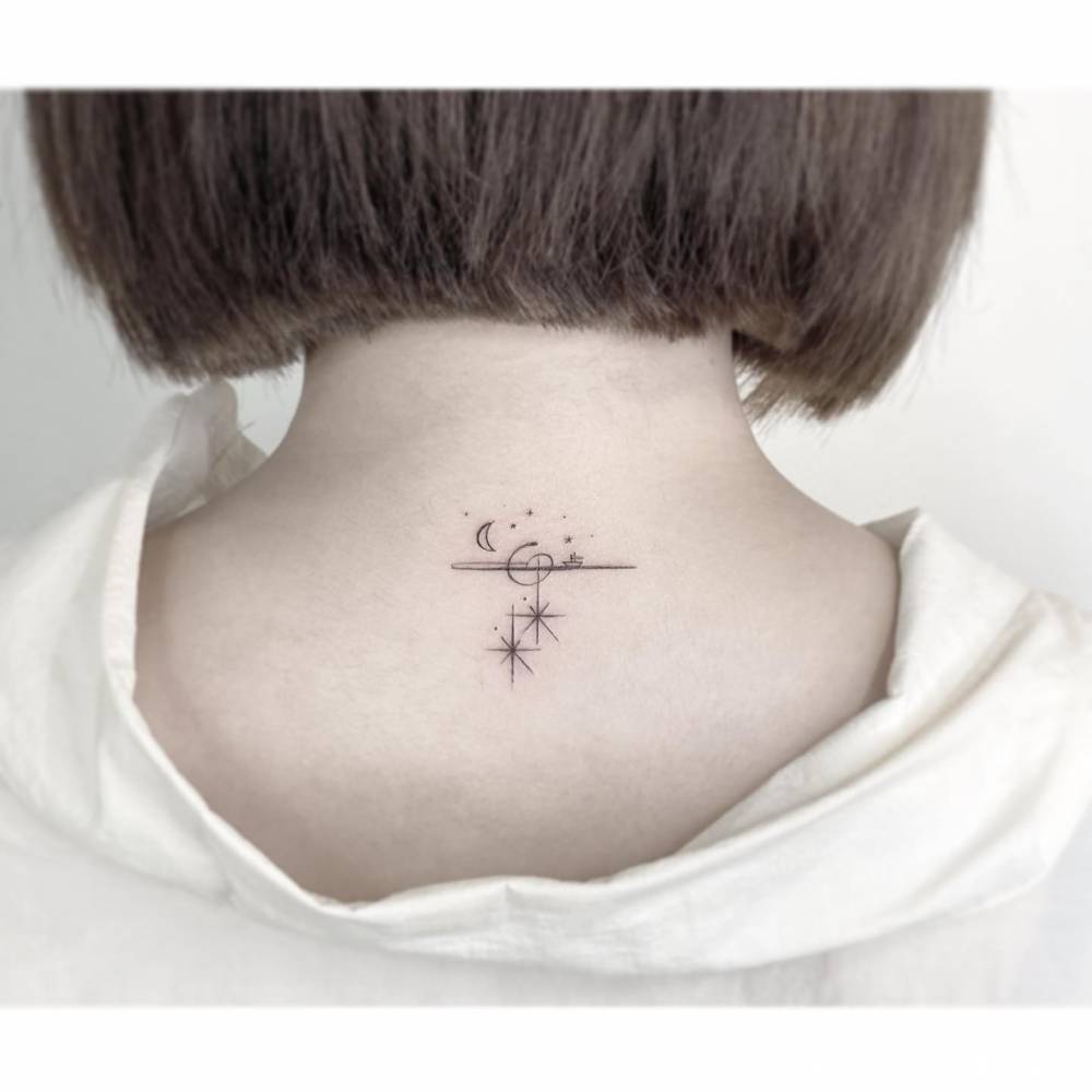 Minimalistic universe tattoo located on the upper back.