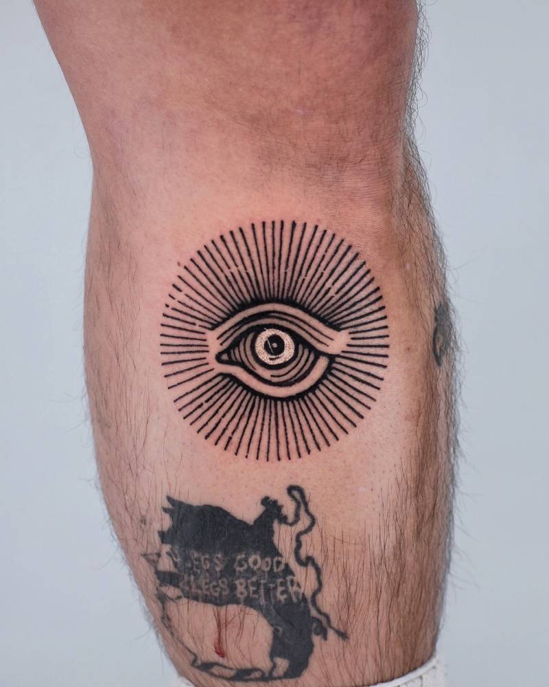Eye tattoo in engraving style done on the shin.