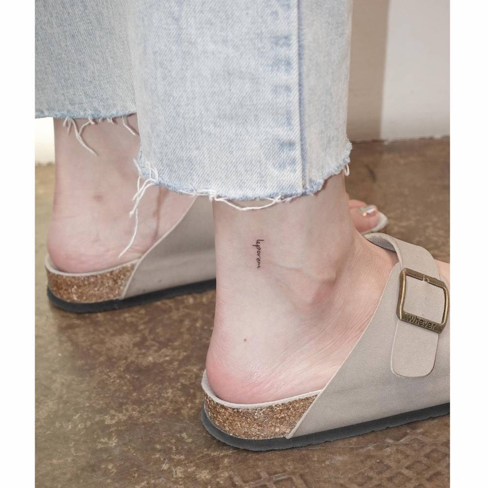 "Leporem" lettering tattoo in handwritten font located on the ankle.