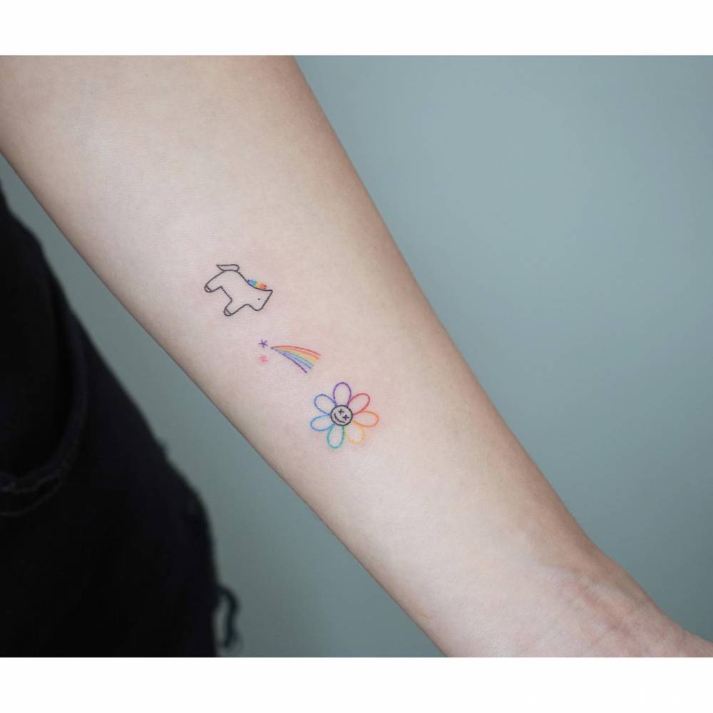 Unicorn, shooting star and daisy flower tattoos in minimalistic style.