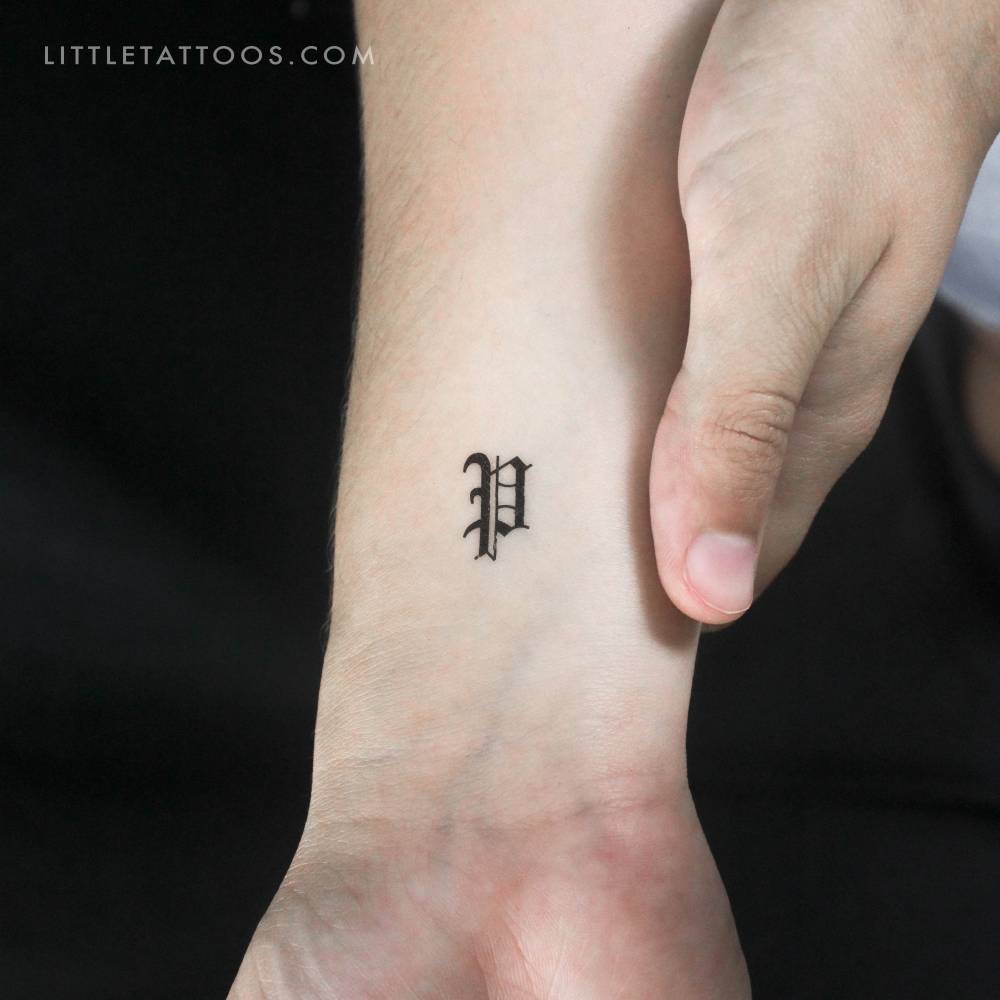 Gothic "P" letter temporary tattoo placed on the wrist.