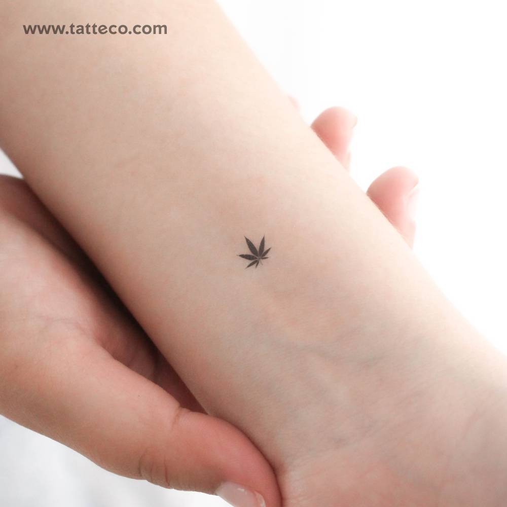 Small minimalistic marijuana leaf temporary tattoo located on the wrist.