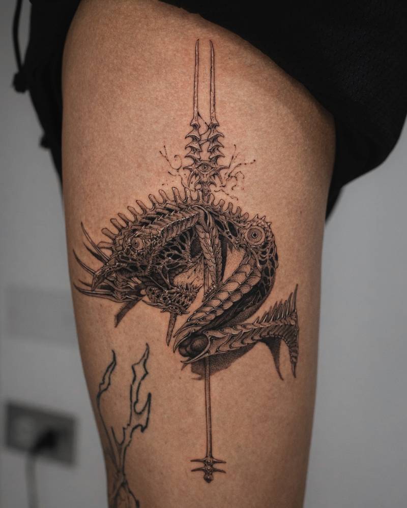 Monster tattoo in comic style located on the thigh.