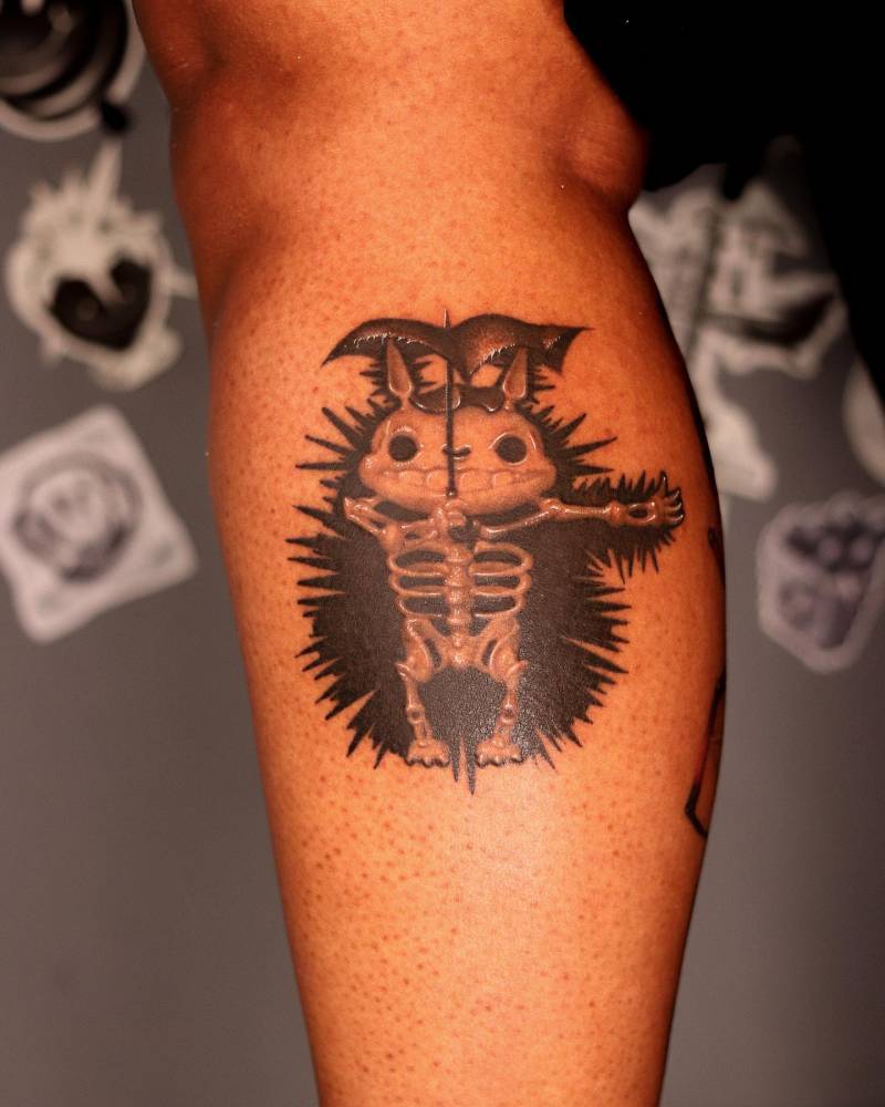 X-ray Totoro tattoo in cartoon style located on the calf.