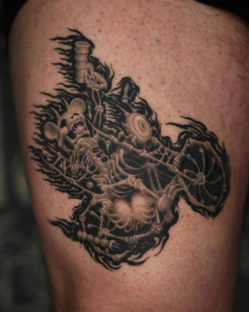 Ghost Rider bear tattooed on the thigh, cartoon style.
