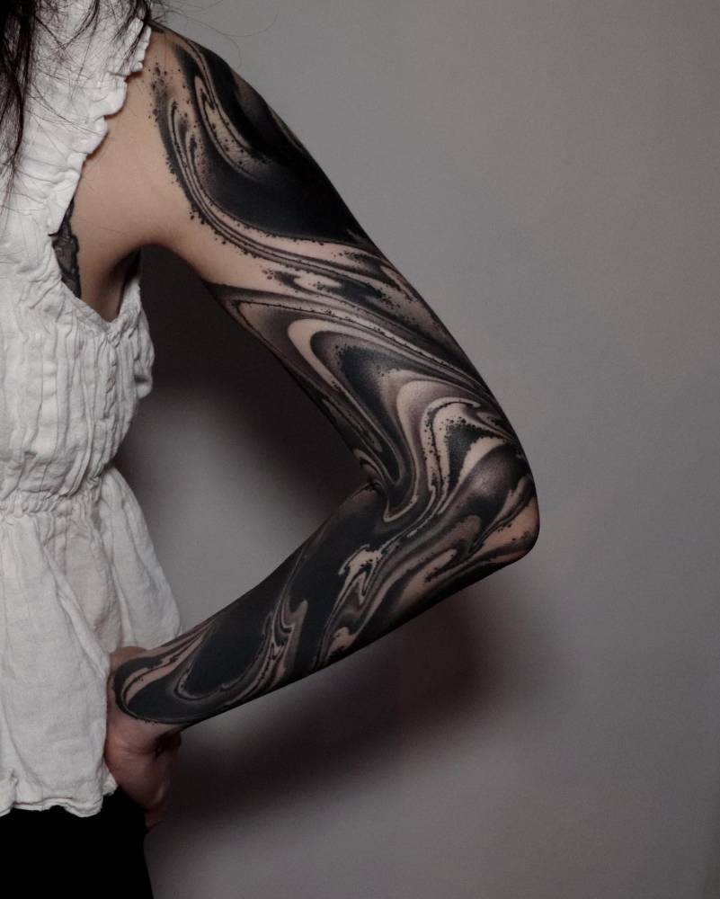 Abstract style flow tattoo sleeve.