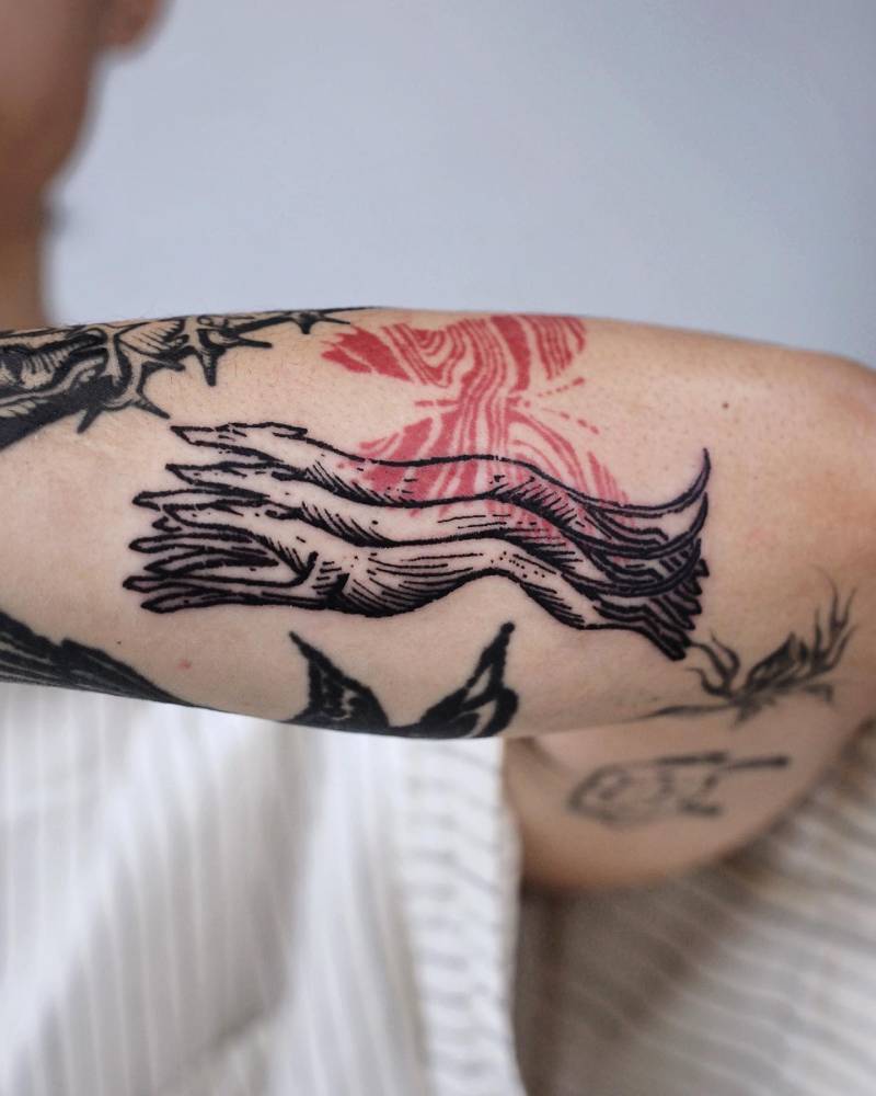 Engraving style greyhounds tattoo located on the forearm.