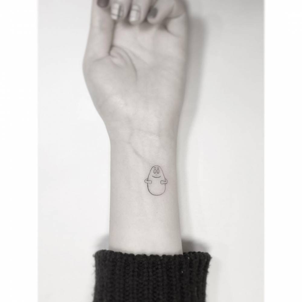 Barbapapa tattoo in minimalistic style placed on the wrist.
