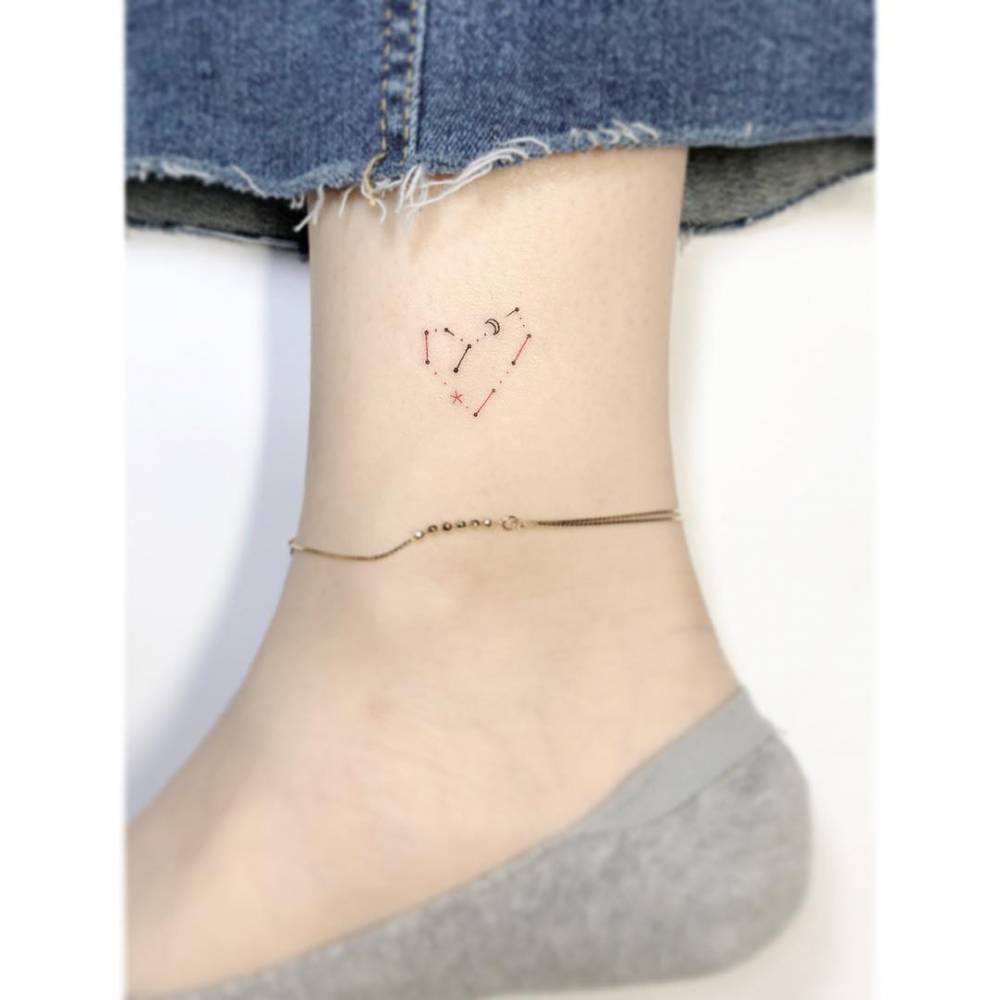 Virgo constellation and heart tattoo in minimalistic style, done on the ankle.