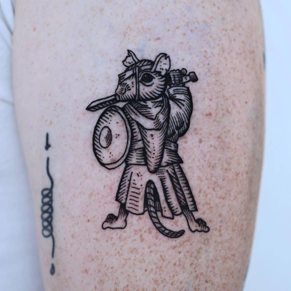 Warrior rat tattoo located on the upper arm, engraving style.